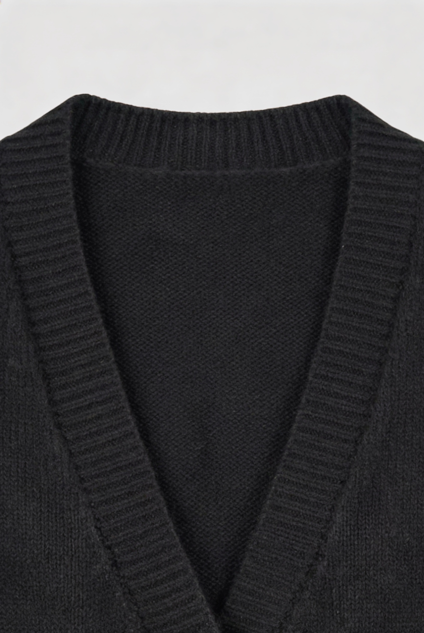 Black knit cardigan by Lumina Wear, Elena, with ribbed details, cozy fit, perfect for layered winter or fall outfits.