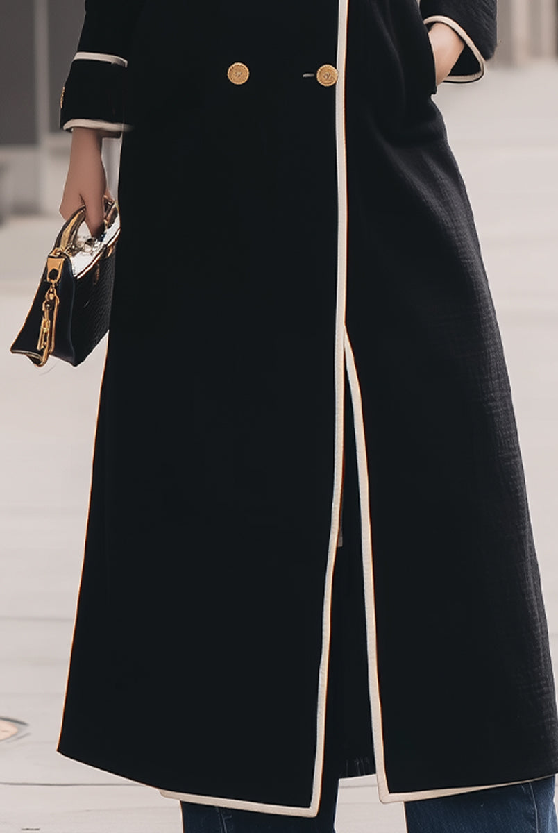 Black double-breasted belted long coat by Lumina Vancouver, featuring a tailored fit and classic design.