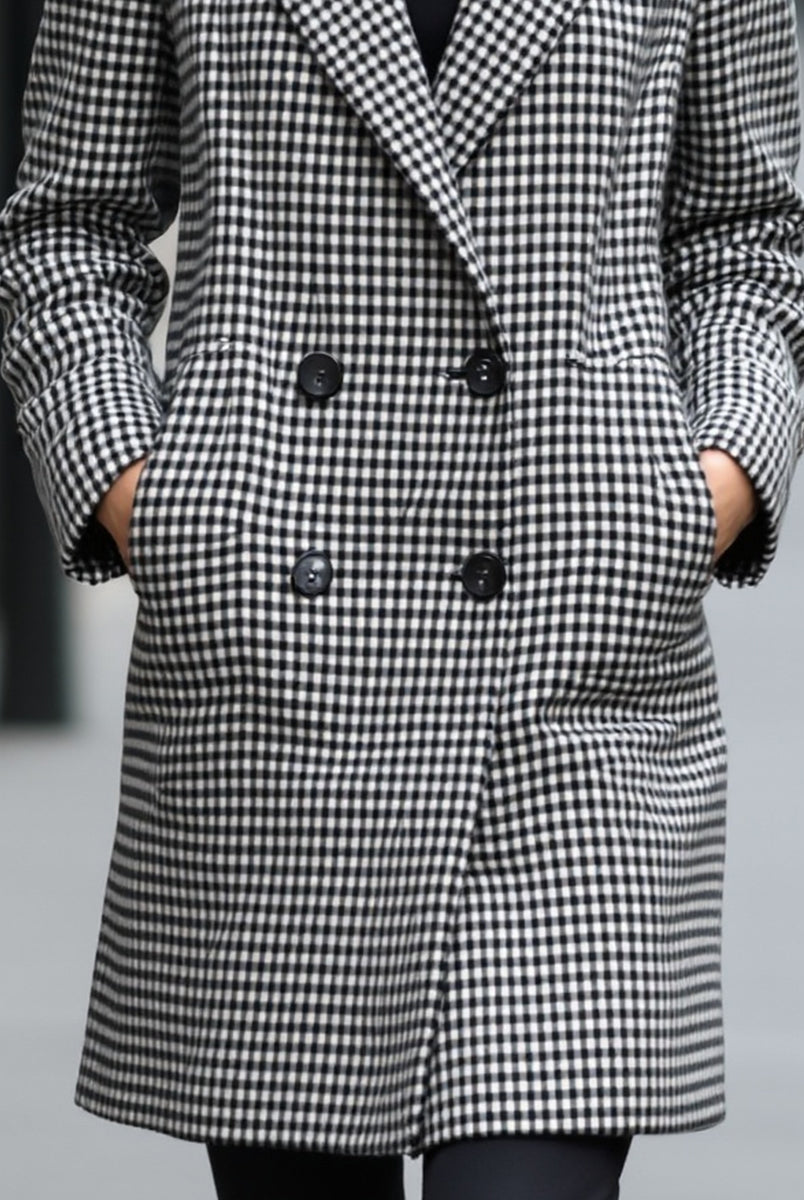 Black Enid double-breasted checked wool coat by Lumina Vancouver, shown on a model in size XS.