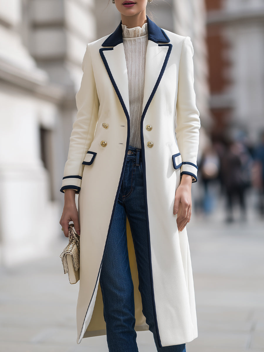 Theodora double-breasted coat by Lumina Vancouver featuring navy contrast trim, white fabric, and tailored design.