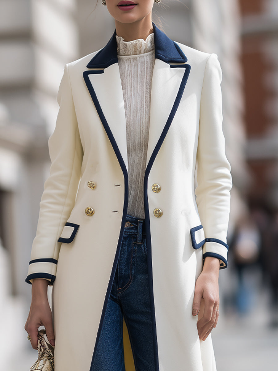 Theodora double-breasted coat by Lumina Vancouver with navy contrast trim, shown in white, size XS, on a model.