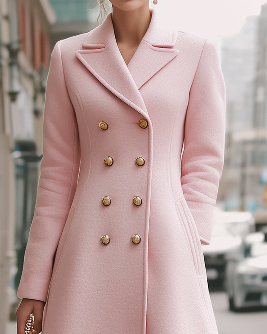 Simone double-breasted wool coat in blush pink by Lumina Wear, shown on a model with a classic collar and tailored fit.