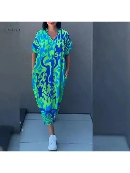 Blue Terttu elegant dress by Lumina Vancouver, featuring a flowing design and stylish fit, showcased on a model.