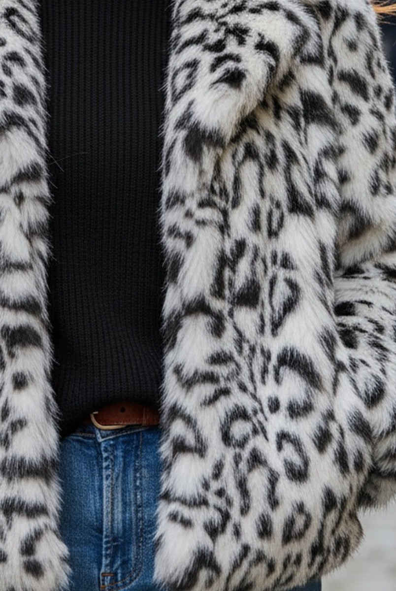 White Doris faux fur jacket by Lumina Vancouver, shown on a model, featuring plush fur and stylish design.