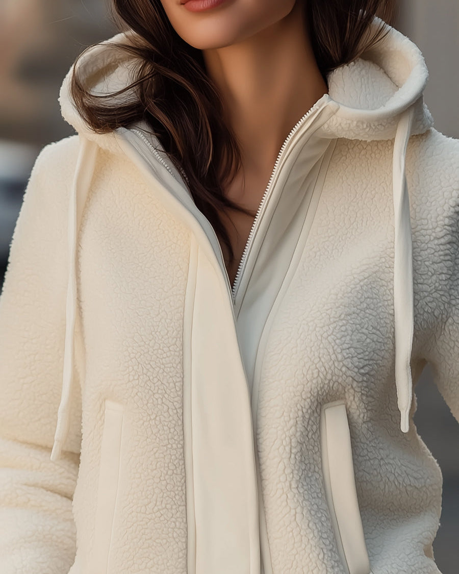 White Lumina Wear Ivy hooded jacket with contrast-trim fleece patchwork, shown on a model, size XS.