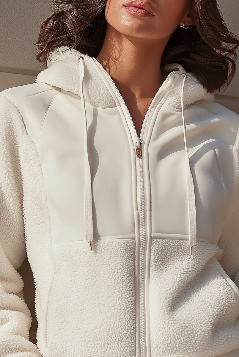 White Ida Lumina Vancouver hooded jacket with zip front and fleece panels, shown on a model in size XS.