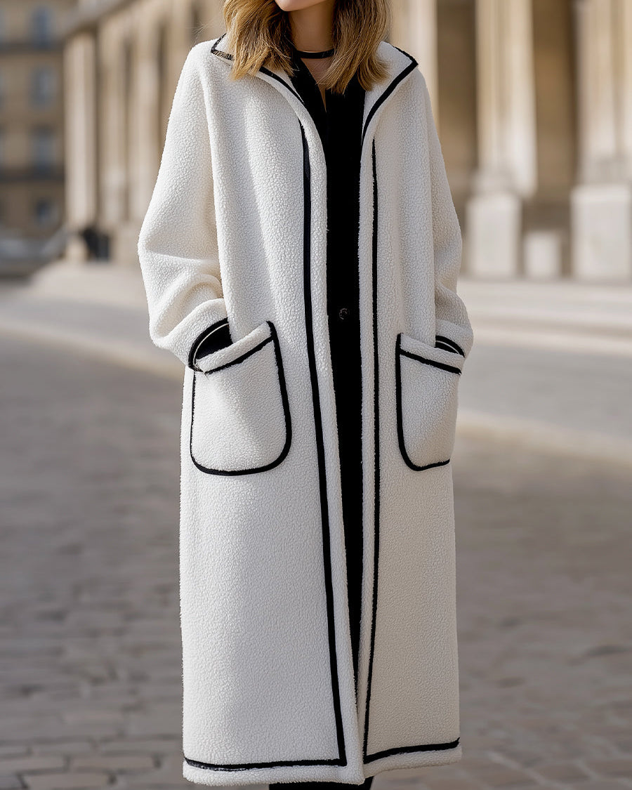 Longline Harlow coat in contrast piped wool-blend fabric by Lumina Wear, shown in white with a tailored fit and stylish design.