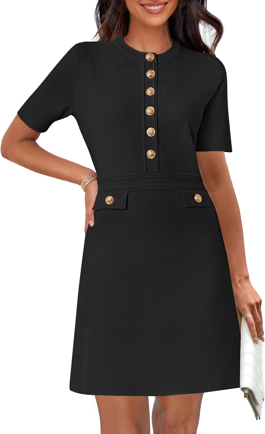 Black Toini short-sleeve A-line mini dress by Lumina Vancouver, shown on a model with a fitted silhouette and simple neckline.