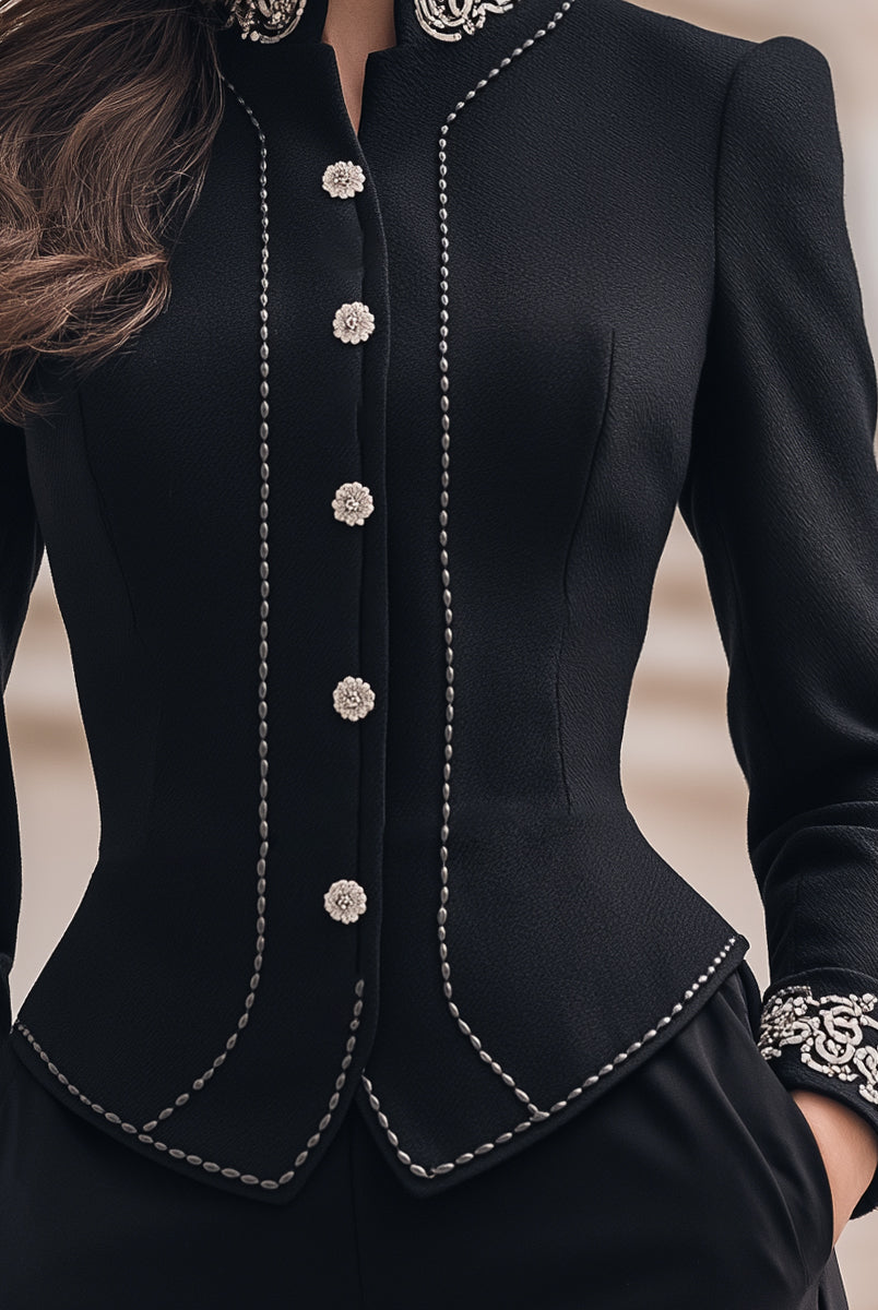 Black tailored blazer with ornate embroidery by Lumina Wear, featuring detailed embroidery on the front, worn by Elena.