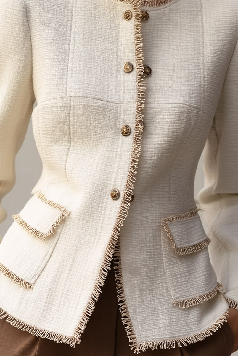 Cream textured blazer with decorative trim from Lumina Wear, styled with a tailored fit and elegant details.