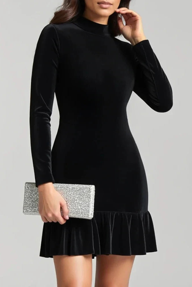 Black velvet mini dress with high neck by Lumina Wear, styled on a model, showcasing a fitted silhouette and elegant design.