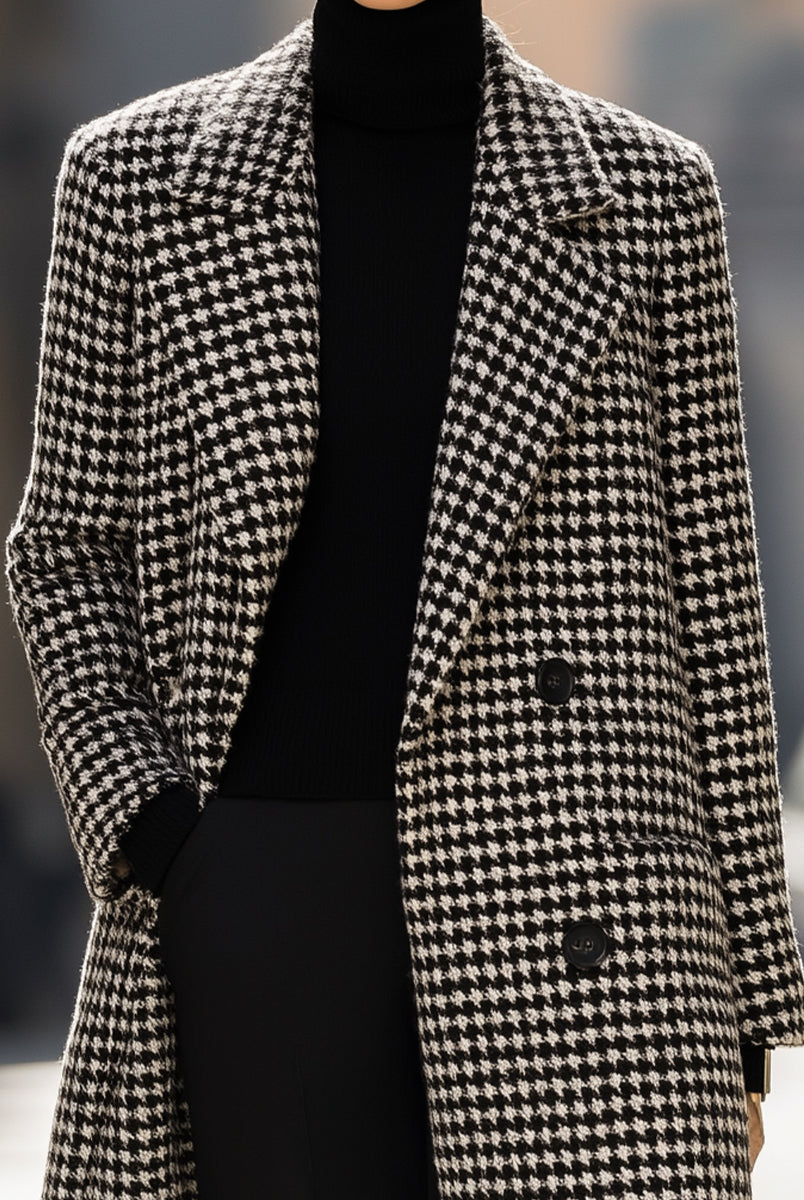 Black houndstooth wool long coat by Lumina Vancouver, featuring a tailored fit and classic design, worn by Elena.