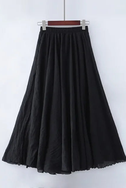 Elegant beige maxi skirt by Lumina Wear featuring a high waist and flowing design, shown on a black mannequin.