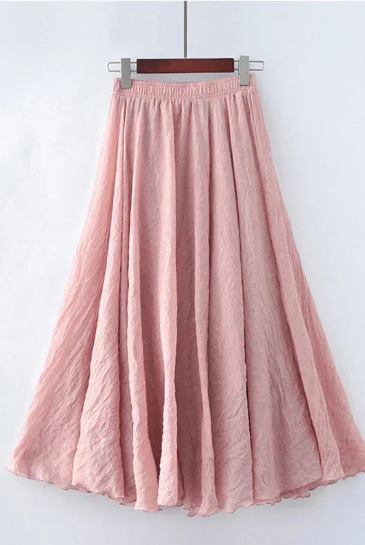 Elegant beige maxi skirt with high waist from Lumina Wear, shown in a flowing style and comfortable fit.