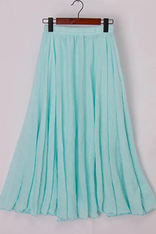 Elegant beige high-waist maxi skirt from Lumina Wear, flowing fabric and stylish design perfect for sophisticated looks.
