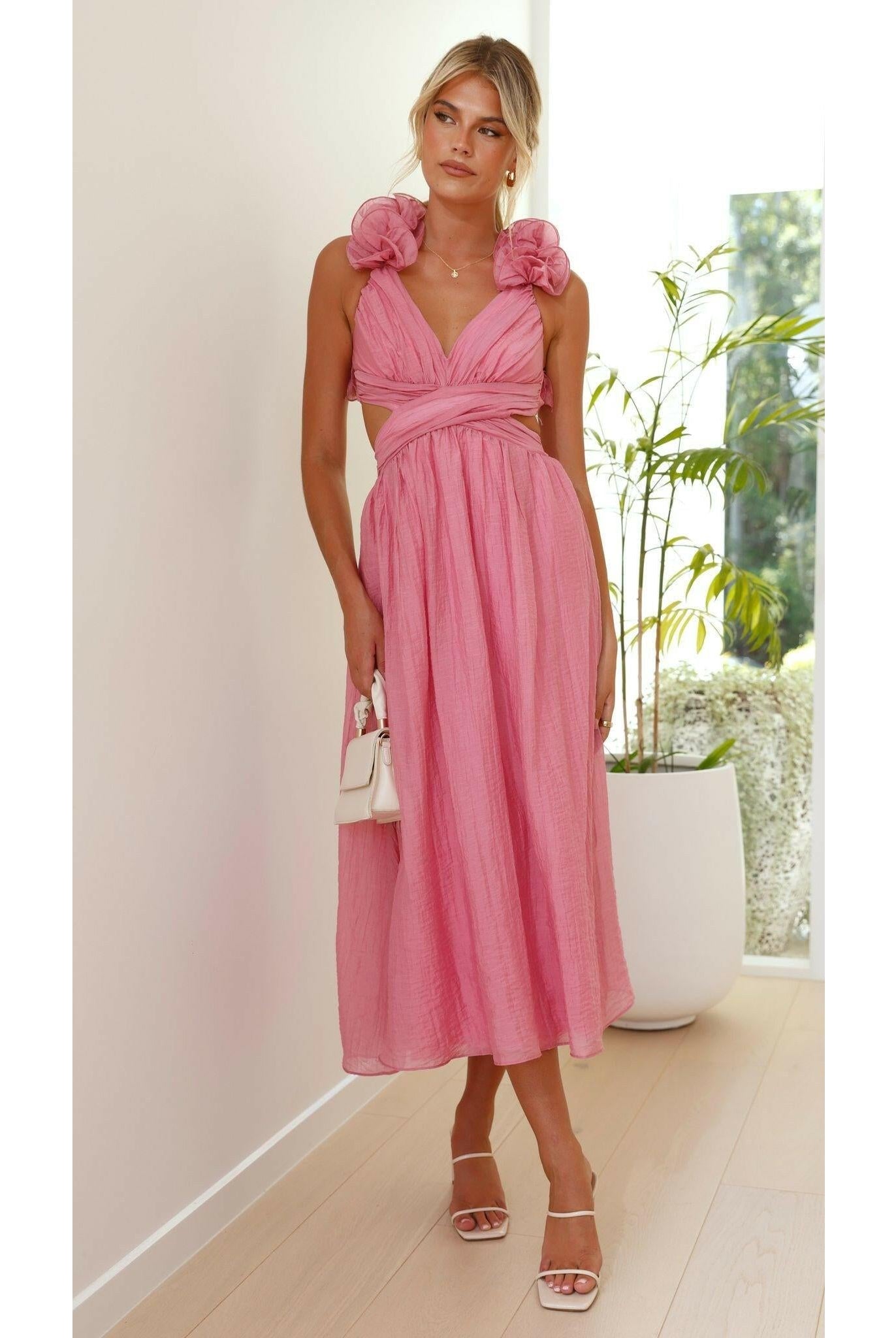 Elegant pink summer dress by Lumina Wear, featuring a flowy design perfect for warm-weather occasions and wedding guests.
