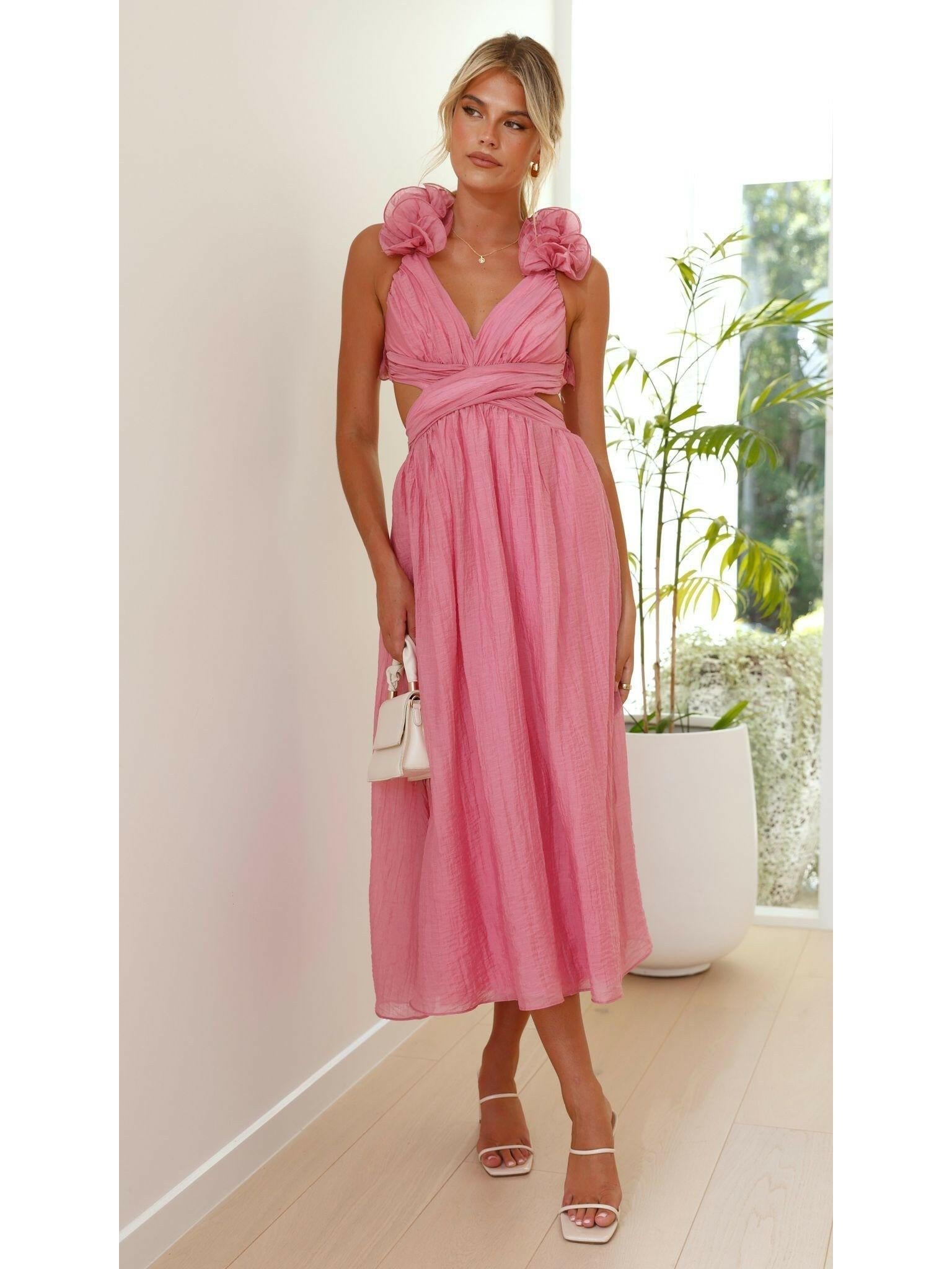 Pink Severine elegant summer wedding guest dress by Lumina Vancouver, sleeveless with a flowing fabric and stylish design.