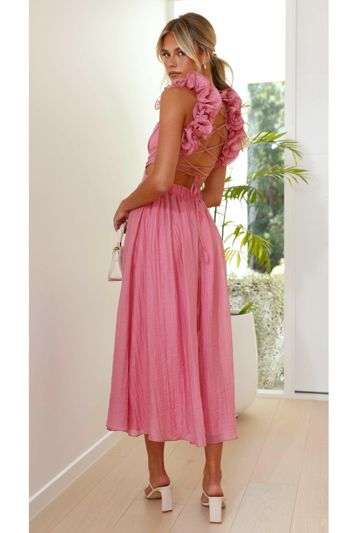 Pink Severine Elegant Summer Dress by Lumina Wear, featuring a flowing design perfect for warm weather and outdoor events.