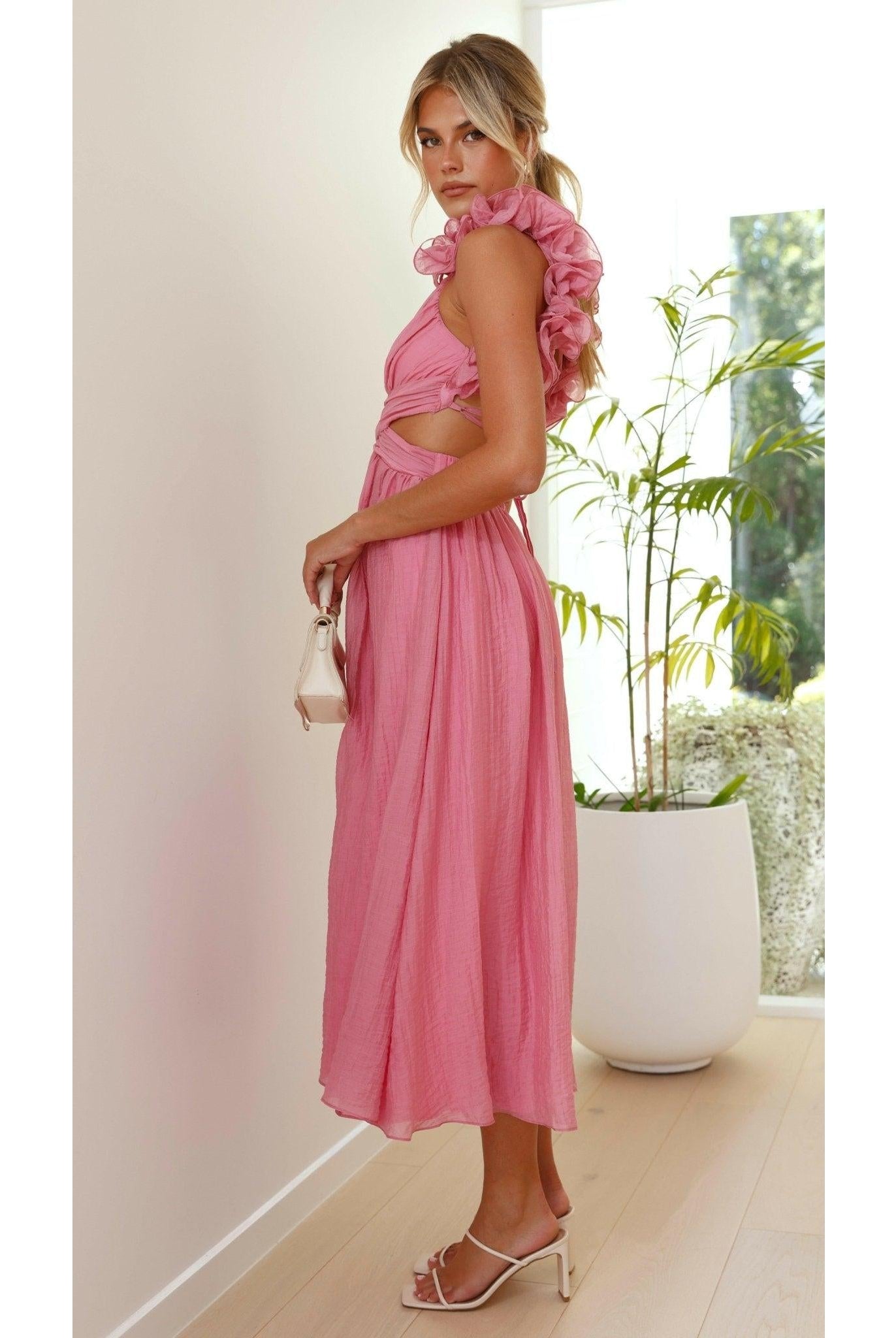Pink Severine elegant summer dress by Lumina Wear, featuring a flowing design perfect for warm weather and wedding guest attire.