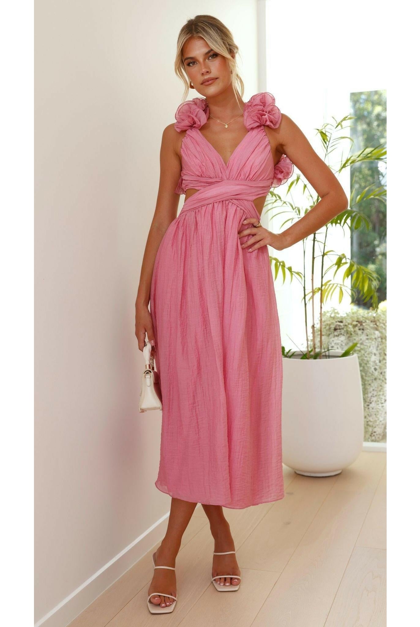 Pink Severine elegant summer dress by Lumina Wear, featuring flowy fabric and stylish design perfect for warm weather and events.