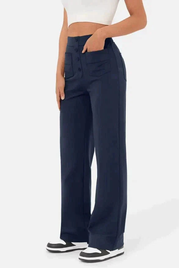 Elsa Lumina Wear high-waist black trousers with pockets, stylish and comfortable for everyday wear, shown on a model.