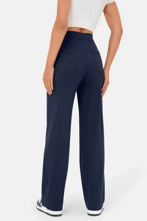 Elsa black high-waist trousers with pockets from Lumina Wear, featuring a comfortable fit and sleek dark blue fabric.