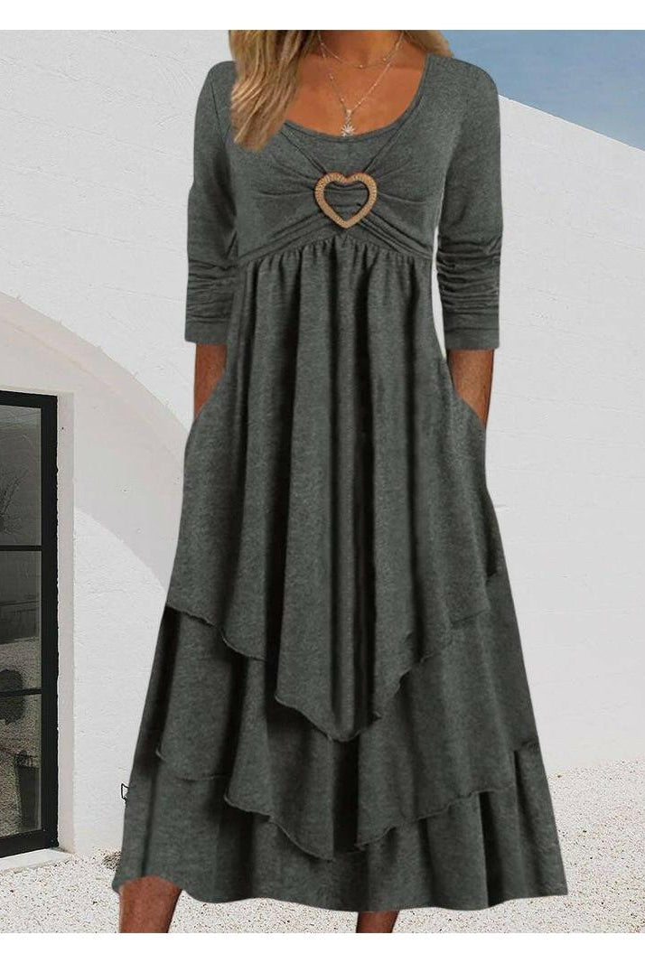 Elsa gray tiered dress with heart detail by Lumina Wear, featuring a flowing design and layered fabric.