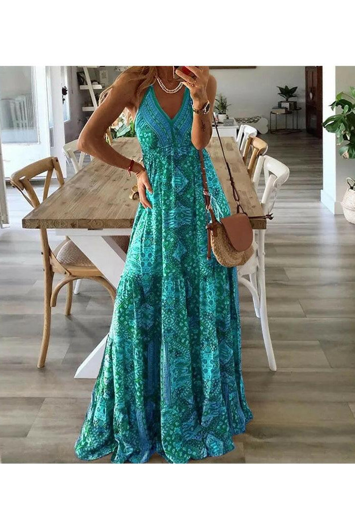 Green Emara™ boho sleeveless dress by Lumina Wear, flowing and casual, displayed on a hanger against a neutral background.