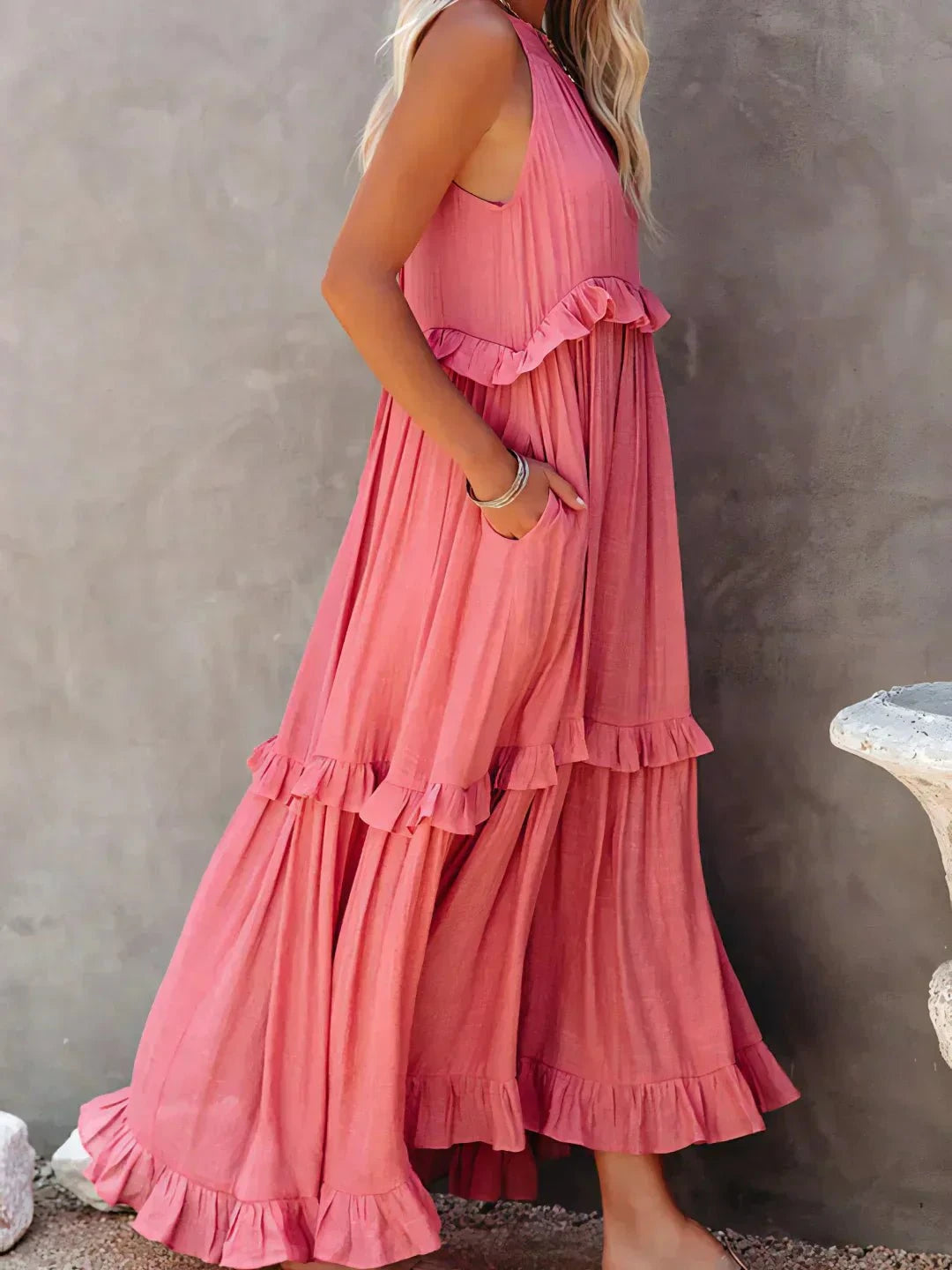 Laila Lumina Vancouver halter ruffle maxi dress in apricot, flowing design with ruffle details, worn by a model.