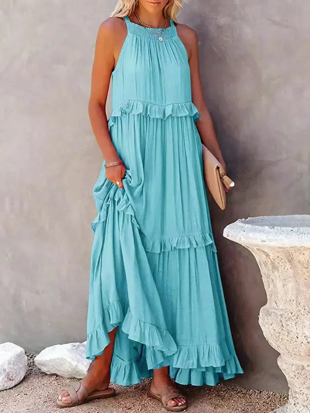 Laila halter ruffle maxi dress in apricot from Lumina Vancouver, flowing fabric with ruffle details, perfect for summer occasions.