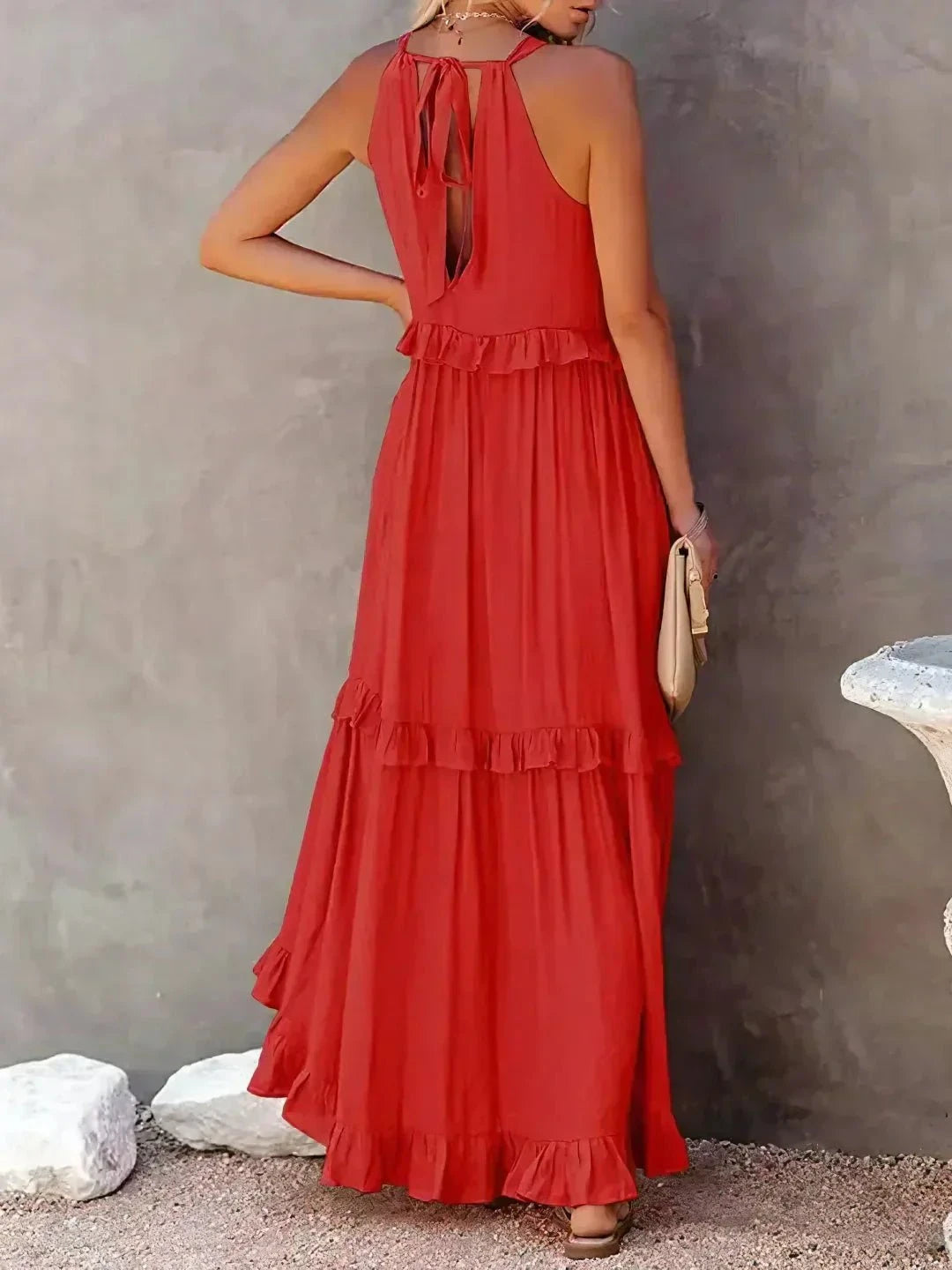 Laila halter ruffle maxi dress in apricot from Lumina Vancouver, flowing fabric, ruffle details, perfect for summer occasions.