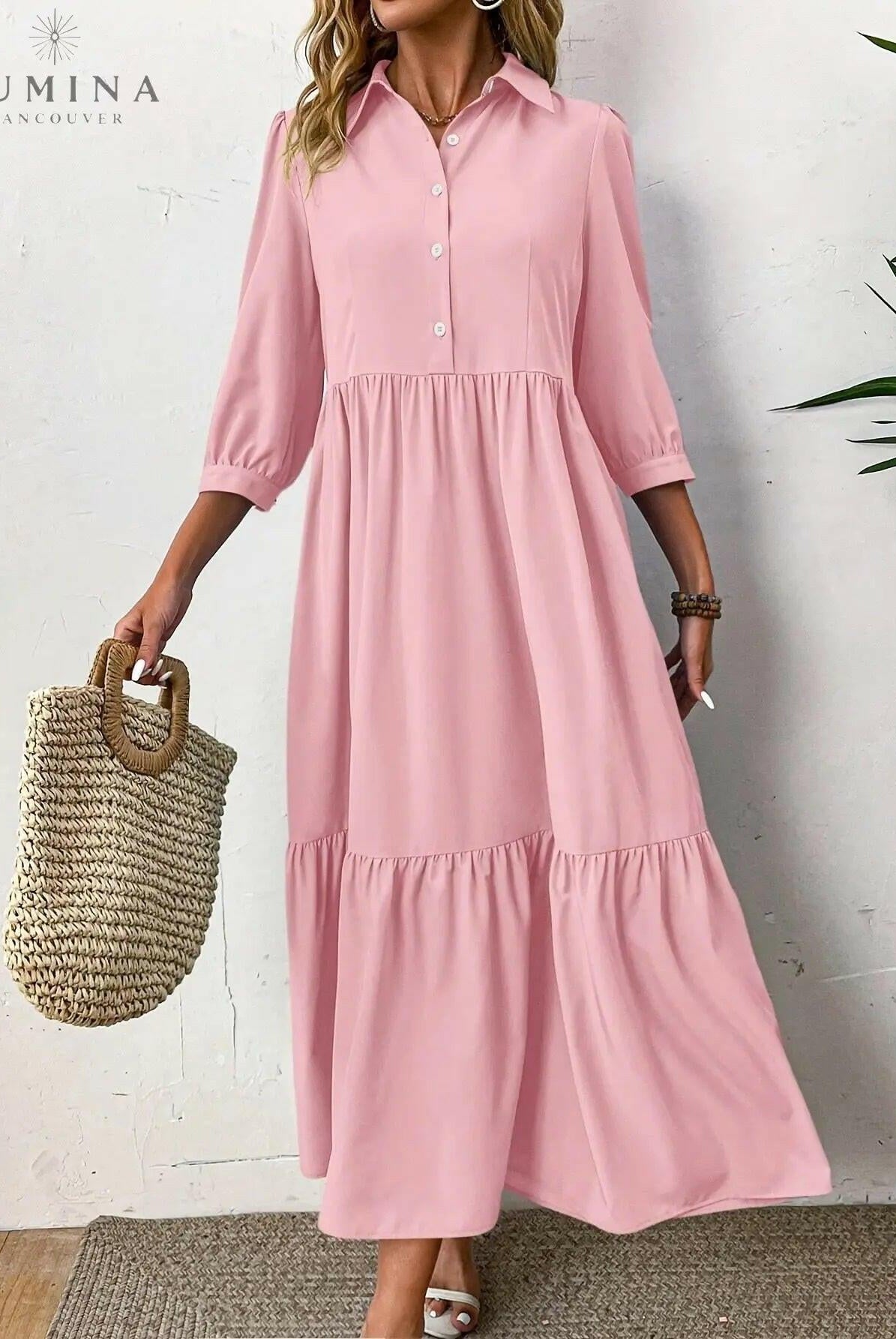Pink Embla Button Dress by Lumina Wear featuring a fitted design and button details, displayed on a mannequin.