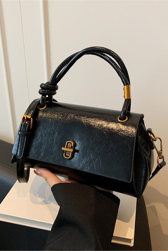 Black Lumina Wear Emma chic versatile satchel with crossbody strap, stylish handbag featuring sleek design and carry options.