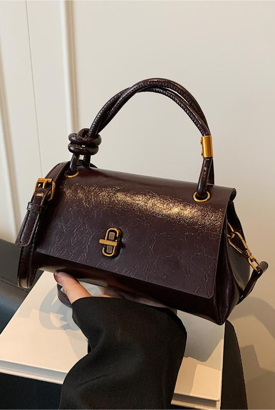 Lumina Wear Emma chic versatile black satchel handbag with crossbody strap, stylish and functional for daily use.