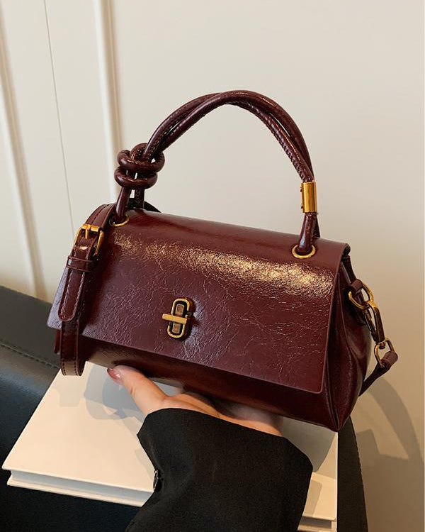 Black Lumina Wear Emma chic versatile satchel handbag with optional crossbody strap, stylish and spacious for everyday use.