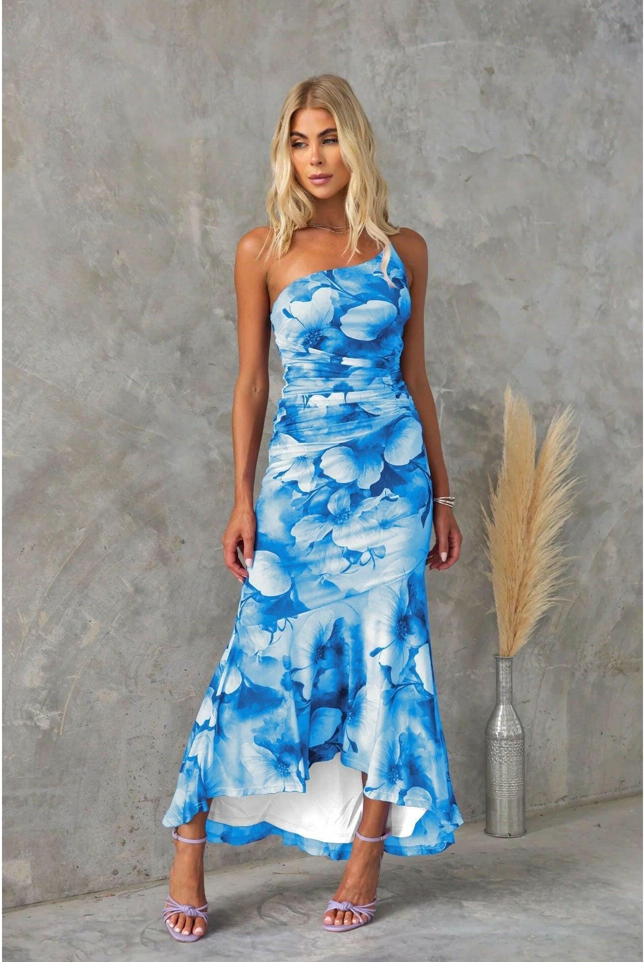 Blue floral summer dress by Lumina Wear featuring a flowy design, perfect for warm weather and outdoor occasions.