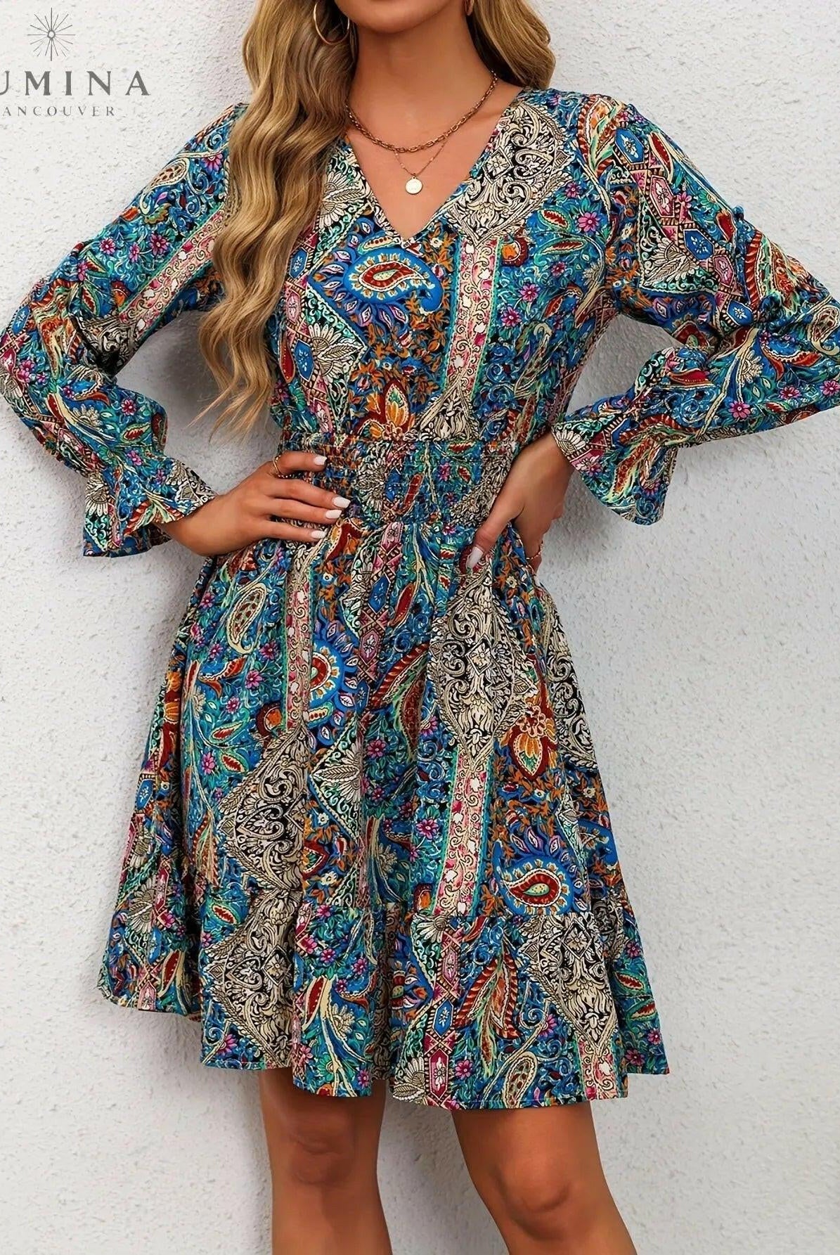 Blue Boho Elegance Dress by Lumina Wear featuring flowing fabric and intricate details, perfect for stylish occasions.