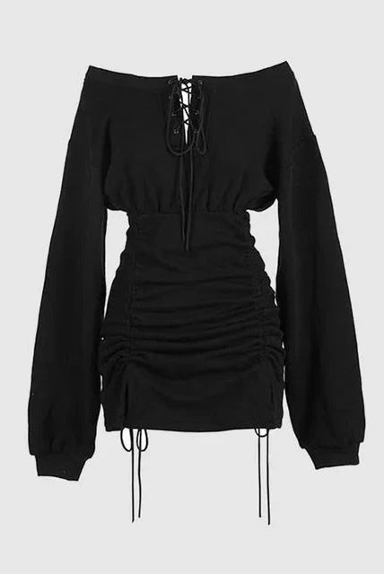 Black Wendeline off-shoulder mini dress by Lumina Wear, featuring a fitted silhouette and stylish neckline, shown on a model.