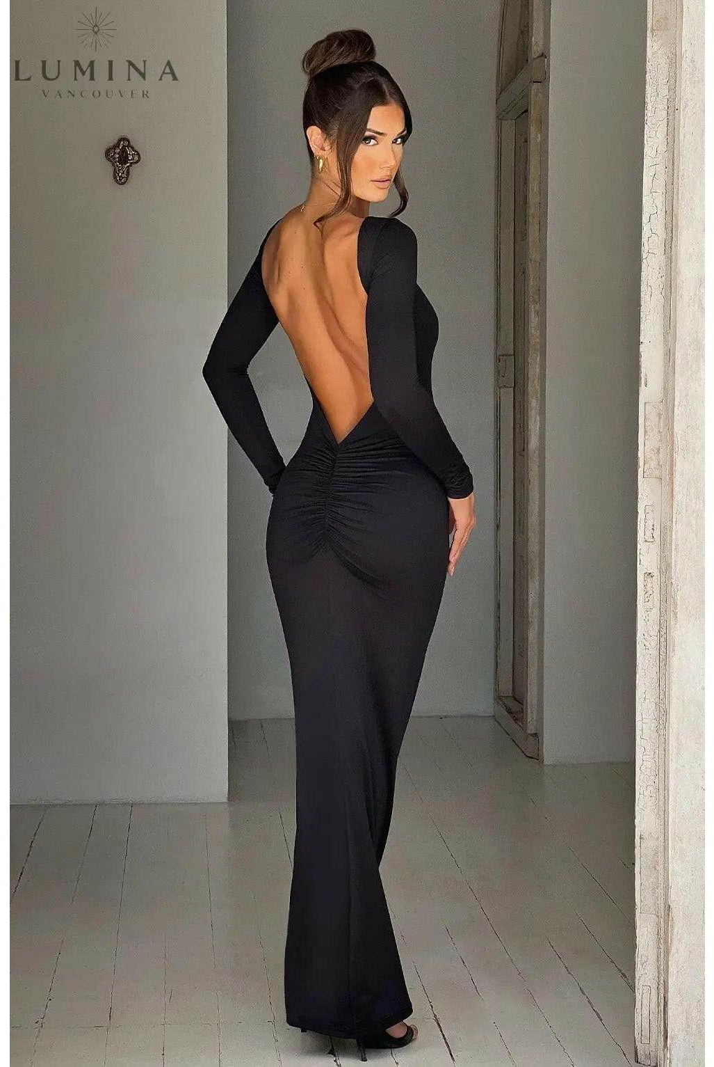 Lumina Wear Evanna boat-neck backless maxi dress in XS, showcasing flowing fabric and elegant design on a model.