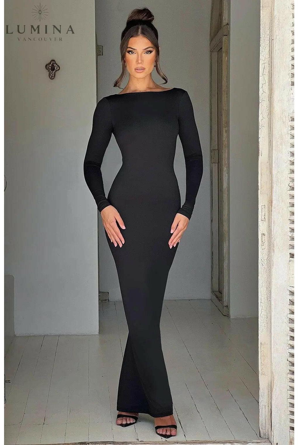 Evanna Lumina Wear boat-neck backless maxi dress in XS, showcasing a flowing silhouette and elegant design on a model.