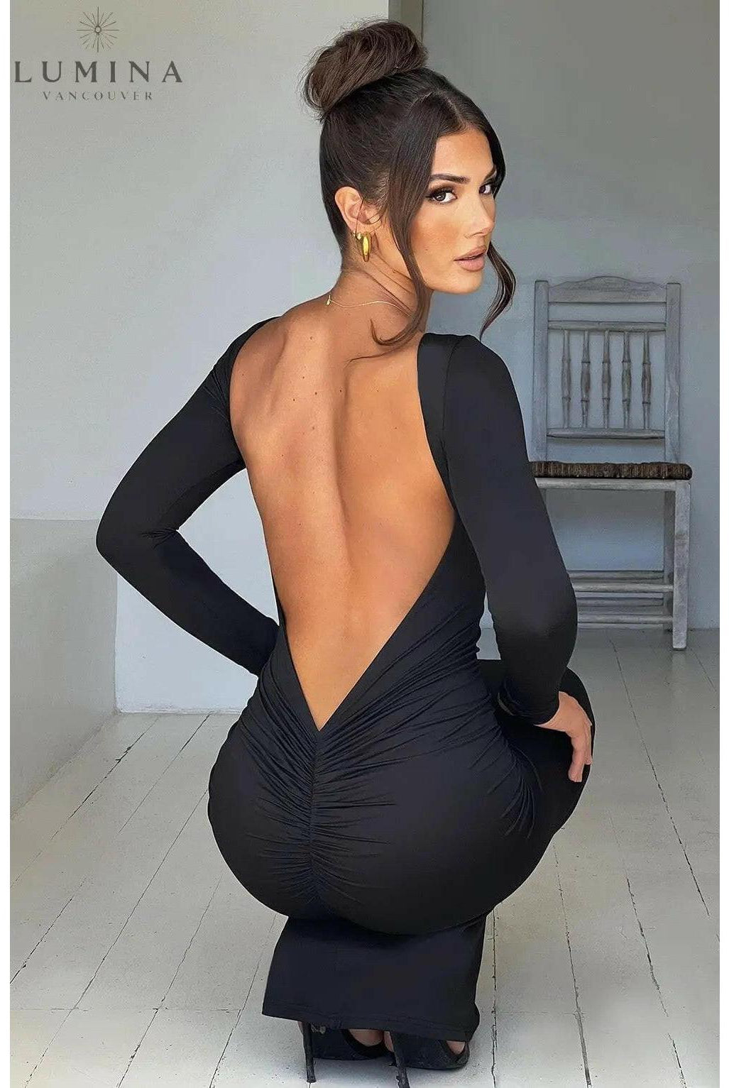 Lumina Wear Evanna boat-neck backless maxi dress in size XS, flowing fabric, elegant design, displayed on a hanger.