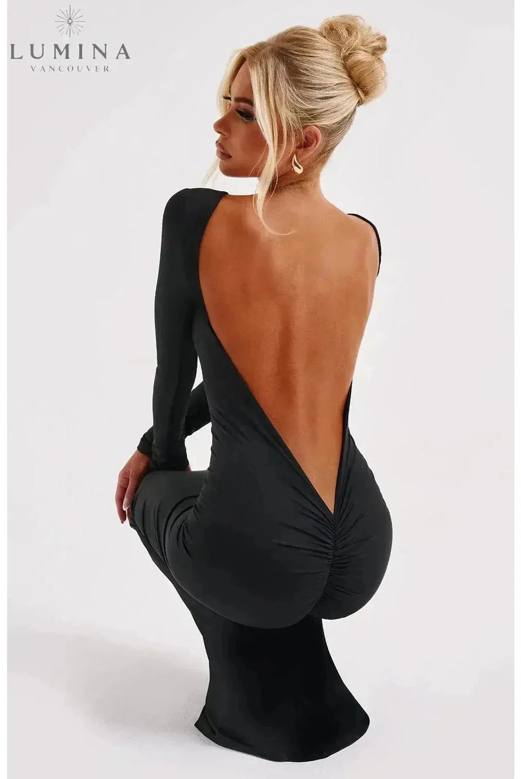 Lumina Wear Evanna boat-neck backless maxi dress in XS, showcasing elegant boat neckline and flowing backless design.