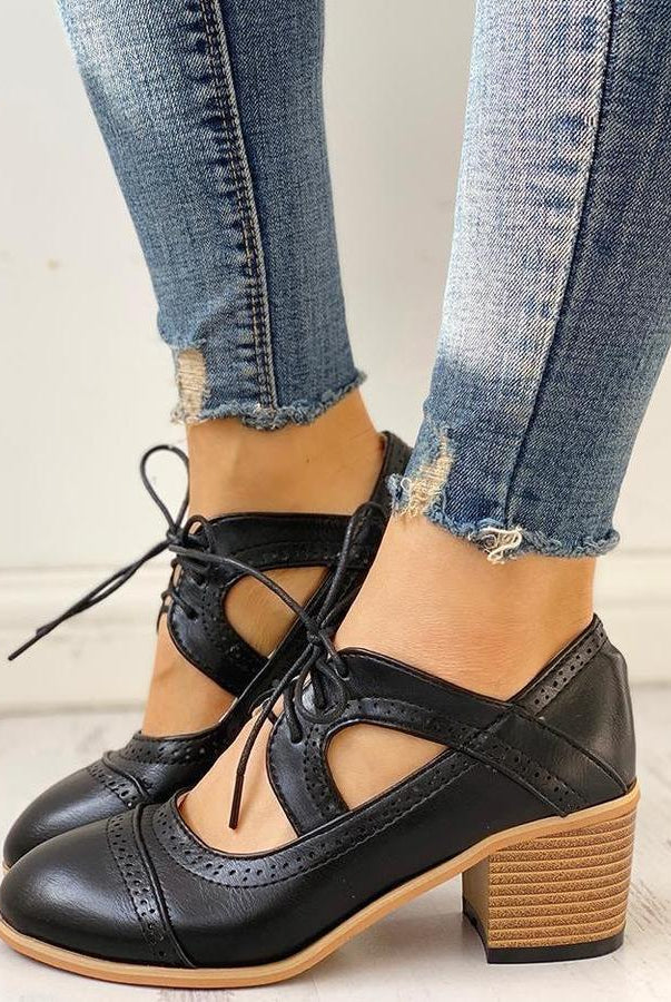 Black Evelyn T-strap heels by Lumina Wear, elegant women's shoes with modern design and stylish ankle strap.