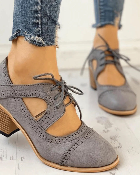 Black Lumina Wear Evelyn T-strap heels with modern design, featuring sleek straps and a stylish silhouette for women.