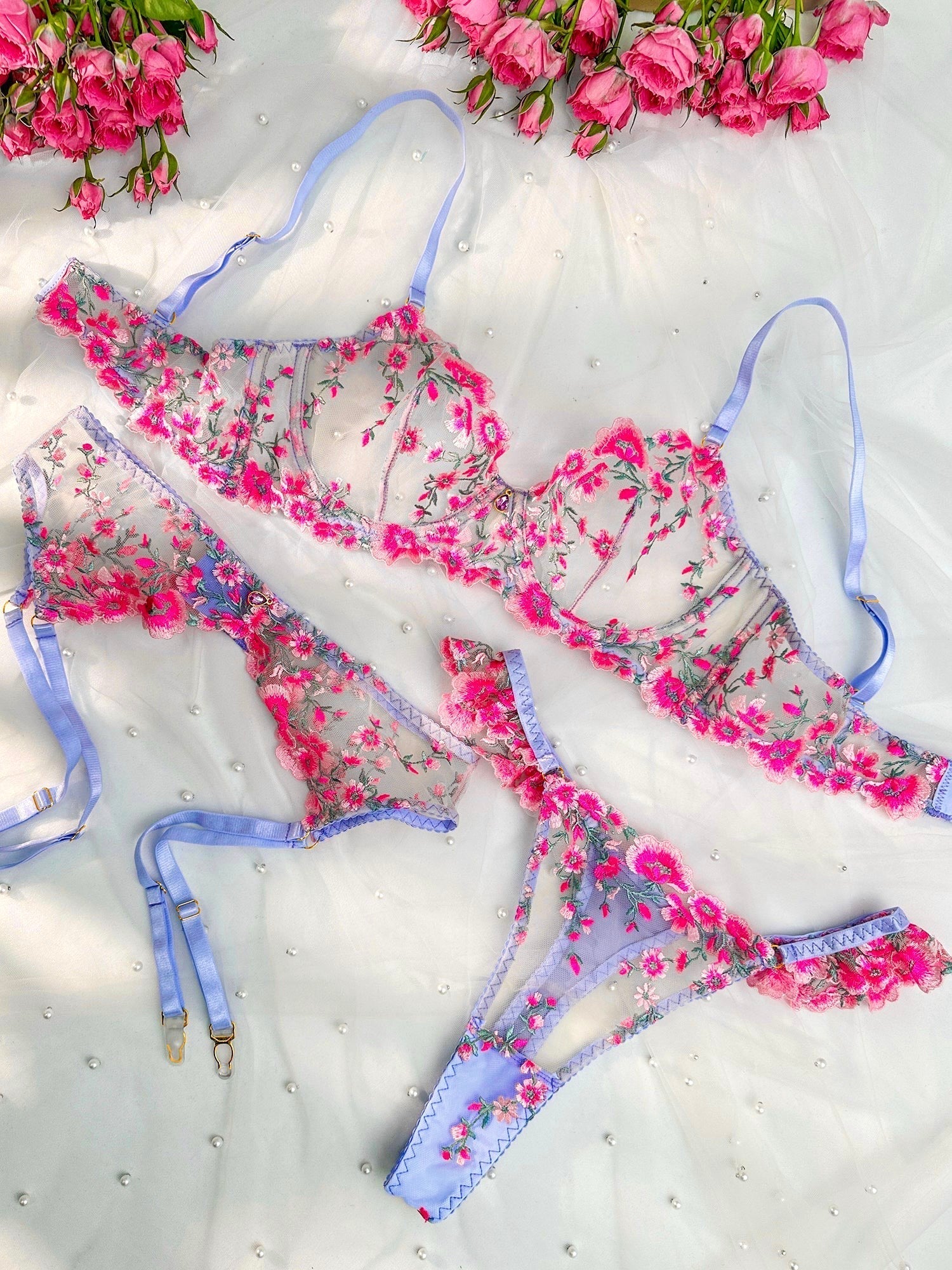 Pink Fantasy Bloom embroidery lingerie set by Lumina Vancouver with three matching pieces, delicate floral details and feminine design.