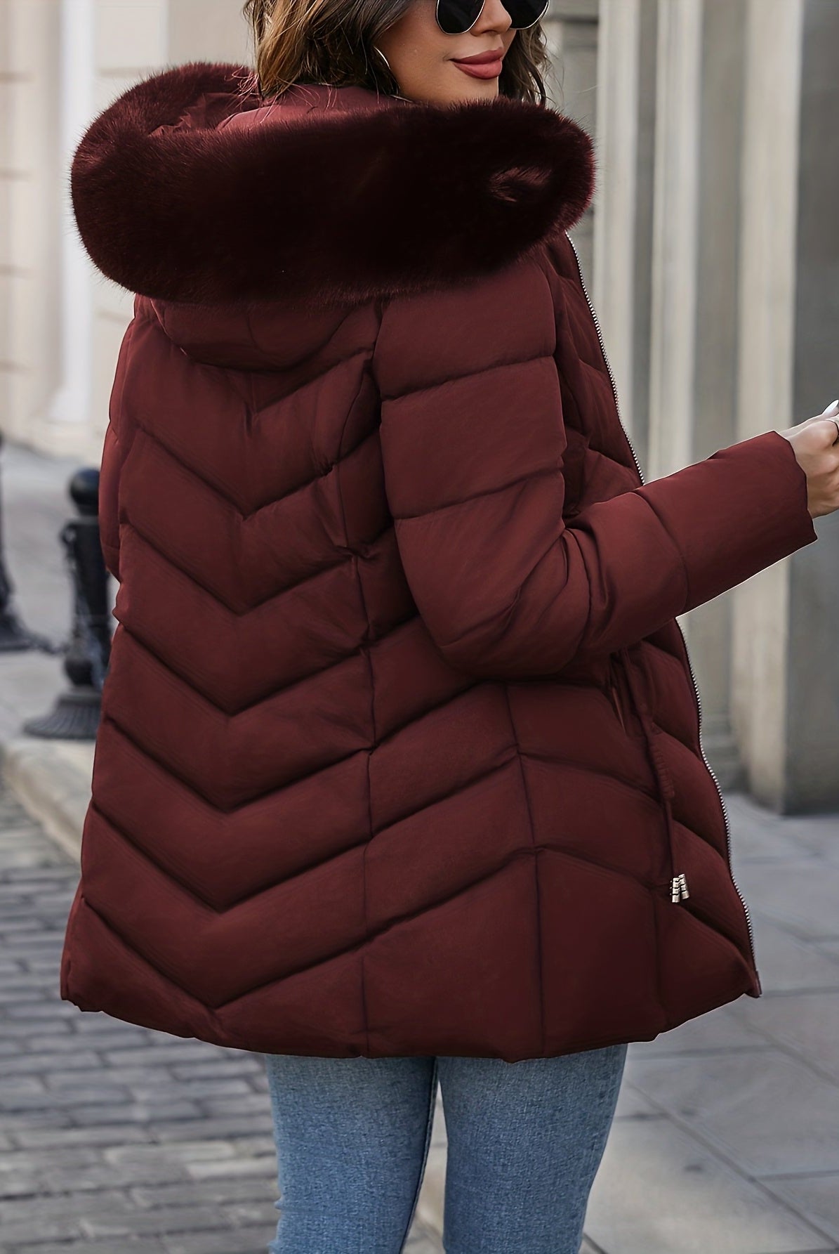 Black Lumina Wear Florence quilted puffer coat with faux-fur hood, stylish and warm winter outerwear for women.