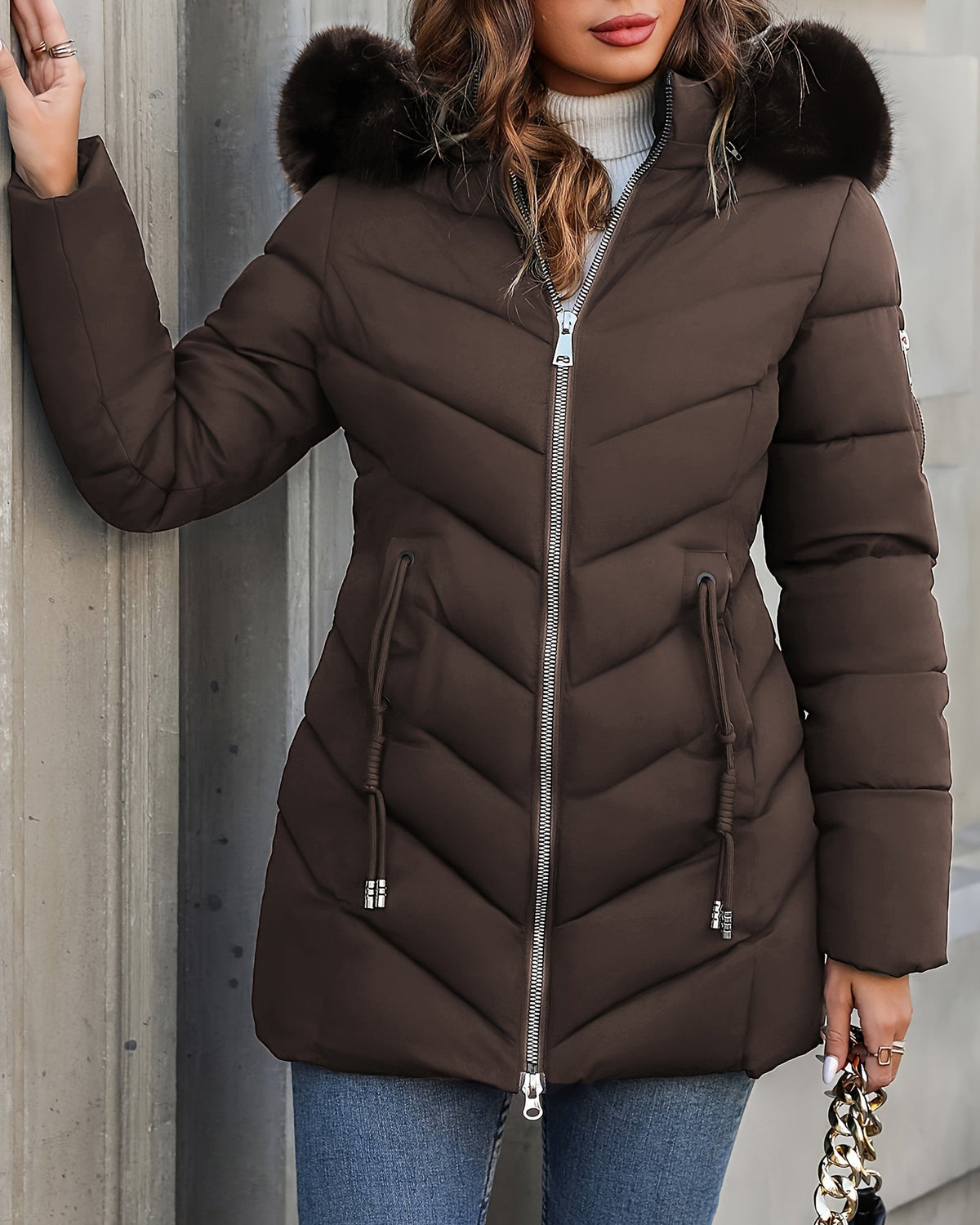 Black Lumina Wear Florence quilted puffer coat with faux-fur hood, stylish winter coat with a padded design and cozy fur trim.