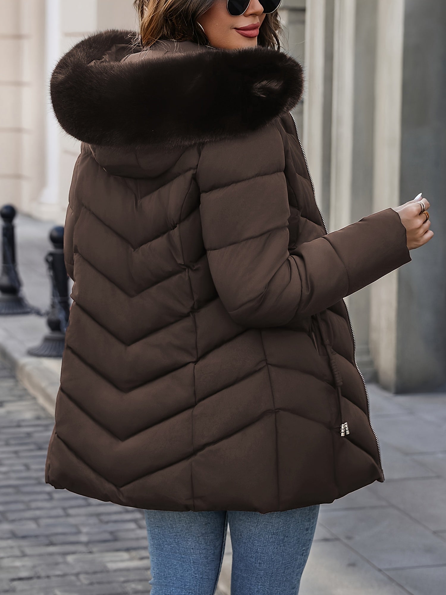 Black Lumina Wear Florence quilted puffer coat with faux-fur hood, stylish winter outerwear for cold weather.