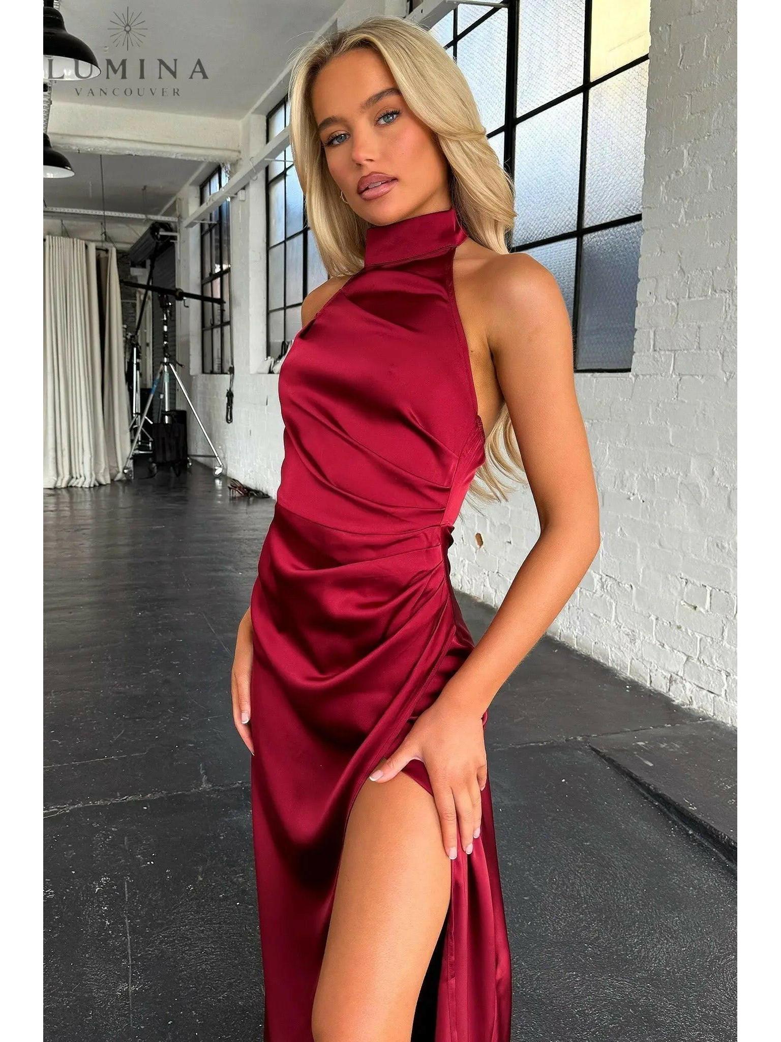 Burgundy Florencia halterneck sleeveless slit maxi dress by Lumina Wear, perfect for wedding guests, displayed on a mannequin.