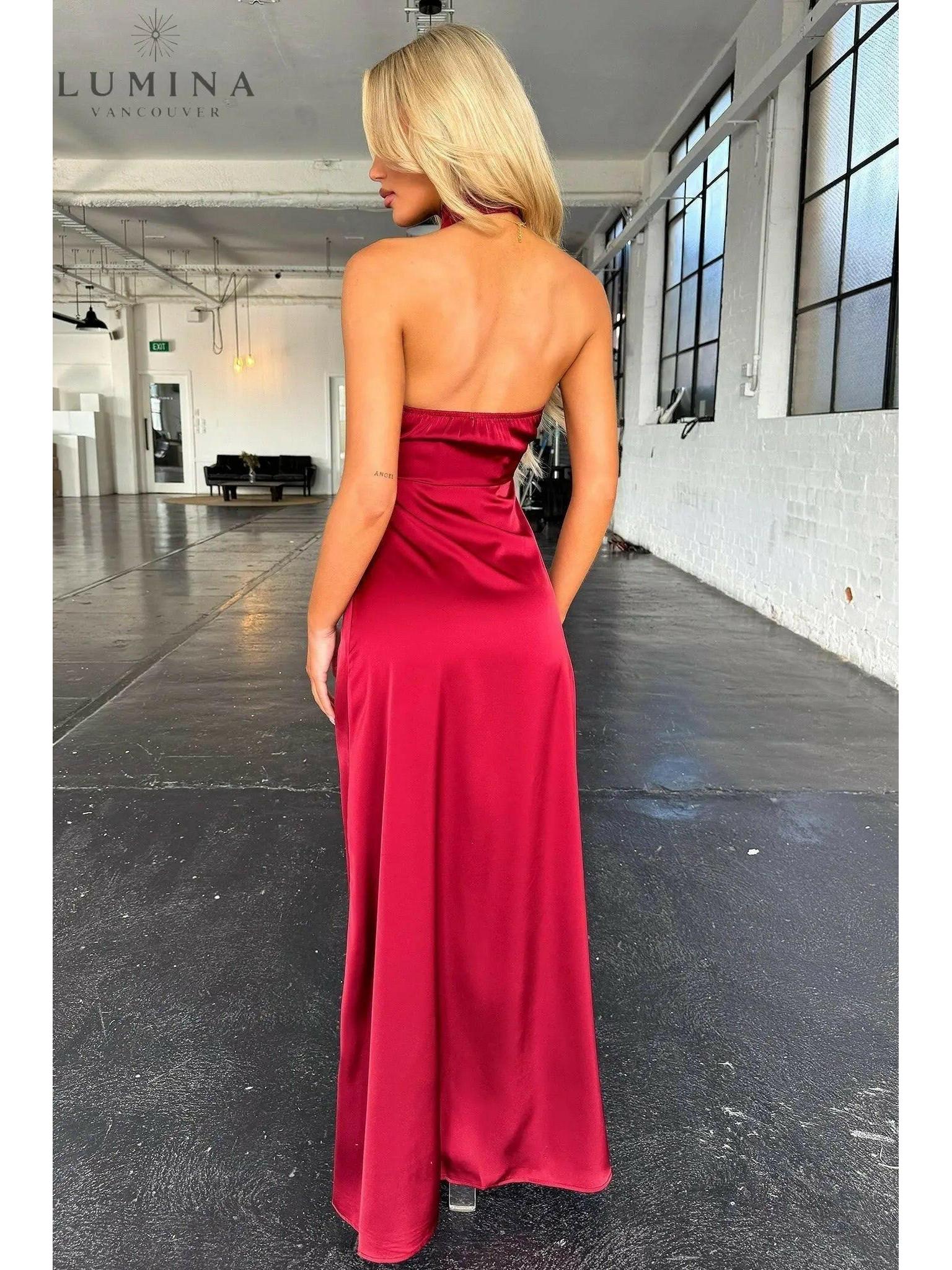 Burgundy Florencia halterneck sleeveless slit maxi dress by Lumina Wear, perfect for wedding guests, displayed on a hanger.